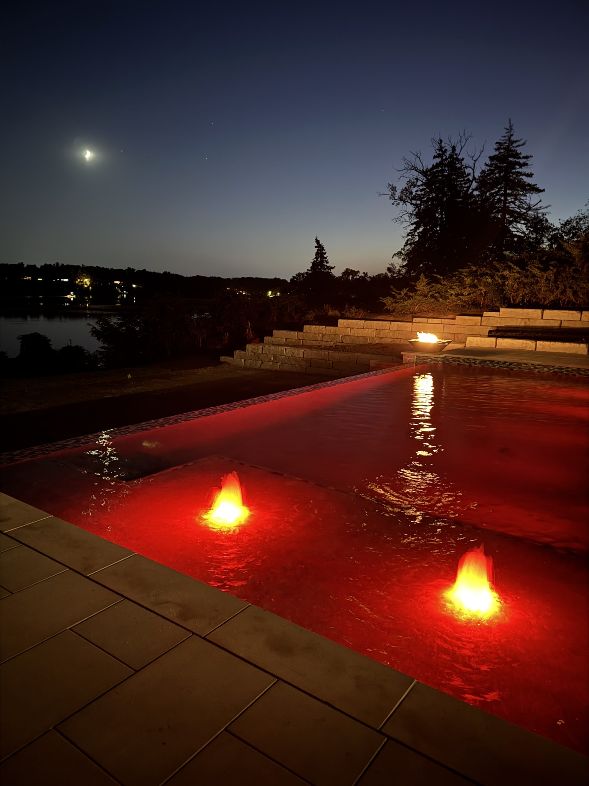 Wide view of luxury backyard swimming pool
